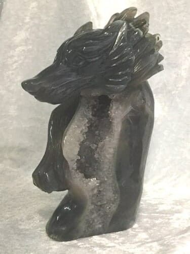 A Detailed Black and White Statue of A Wolf — Crystal Cauldron In South Mackay, QLD