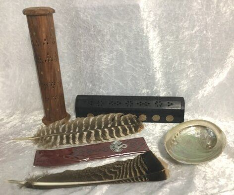 A Collection of Incense Holders, Feathers, and A Small Dish — Crystal Cauldron In South Mackay, QLD