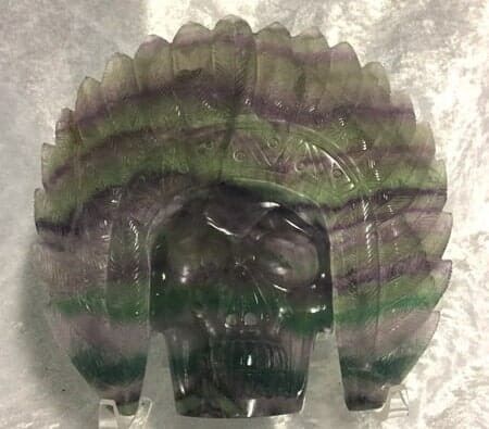 A Green and Purple Skull Decorated with A Feathered Headdress — Crystal Cauldron In South Mackay, QLD