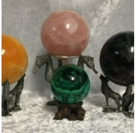 Four Crystal Spheres Are Displayed on Decorative Stands — Crystal Cauldron In South Mackay, QLD