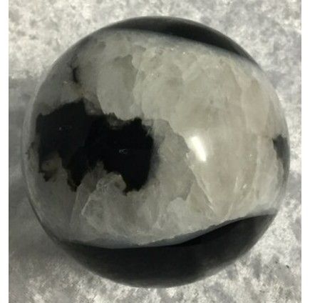 A Spherical Stone With a Smooth, Glossy Surface — Crystal Cauldron In South Mackay, QLD