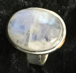A Silver Ring Featuring a Luminous Blue Moonstone — Crystal Cauldron In South Mackay, QLD