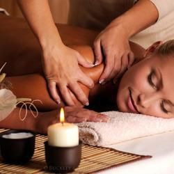 A Relaxing Spa Scene Featuring a Person Receiving a Massage — Crystal Cauldron In South Mackay, QLD