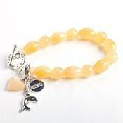 Light Orange Bracelet On White Surface — Crystal Cauldron In South Mackay, QLD