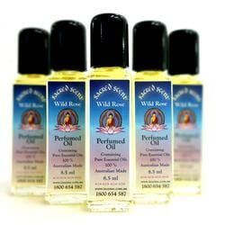 Five Bottles of Wild Rose Perfumed Oil Lined Up — Crystal Cauldron In South Mackay, QLD