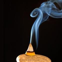 A Lit Incense Cone Emits Wisps of Delicate Blue Smoke — Crystal Cauldron In South Mackay, QLD