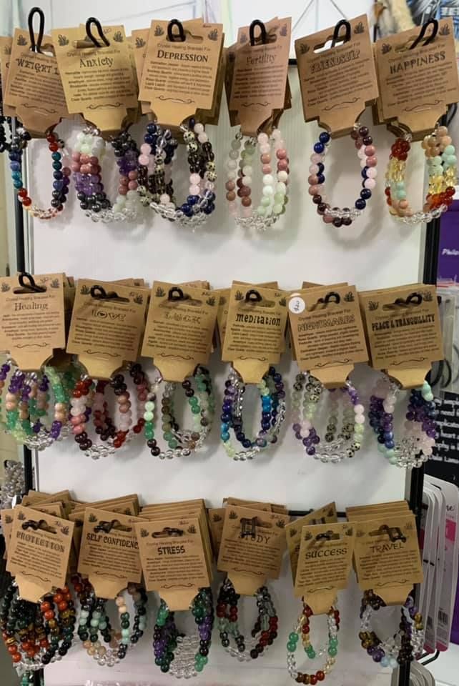 A Bunch of Bracelets Are Hanging on A Rack in A Store — Crystal Cauldron in South Mackay, QLD