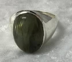 An Elegant Ring Displaying a Striking Green Stone — Crystal Cauldron In South Mackay, QLD