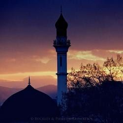 Silhouetted Mosque with A Tall Minaret Against a Vibrant Sunset Sky — Crystal Cauldron In South Mackay, QLD