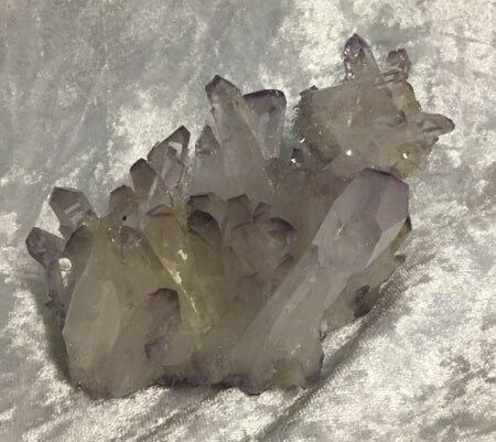 A Large Purple Rock Adorned with Shimmering Crystals — Crystal Cauldron In South Mackay, QLD