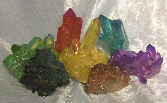 A Group of Colorful Crystals Displayed on a Textured White Surface — Crystal Cauldron In South Mackay, QLD