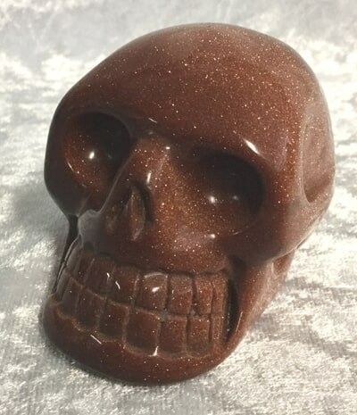 A Brown Stone Carved in The Shape of A Skull — Crystal Cauldron In South Mackay, QLD