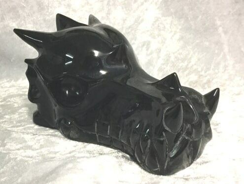 A Detailed Black Dragon Head Featuring Prominent Horns — Crystal Cauldron In South Mackay, QLD