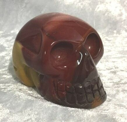 A Striking Red and Yellow Skull-Shaped Stone — Crystal Cauldron In South Mackay, QLD