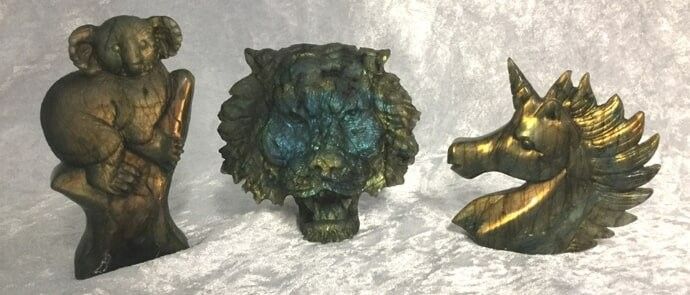 Three Bronze Animal Statues Alongside a Majestic Lion Statue — Crystal Cauldron In South Mackay, QLD