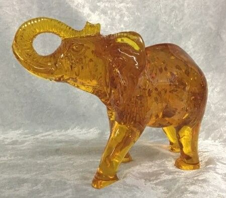  A Beautifully Crafted Yellow Glass Elephant Figurine — Crystal Cauldron In South Mackay, QLD
