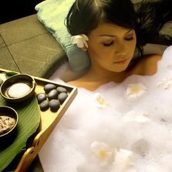 A Serene Spa Setting Featuring a Person Relaxing in A Bubble Bath — Crystal Cauldron In South Mackay, QLD