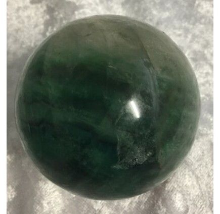 A Polished, Dark Green Crystal Sphere With Subtle Lighter Streaks — Crystal Cauldron In South Mackay, QLD