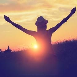 Silhouette of A Woman with Arms Outstretched — Crystal Cauldron In South Mackay, QLD
