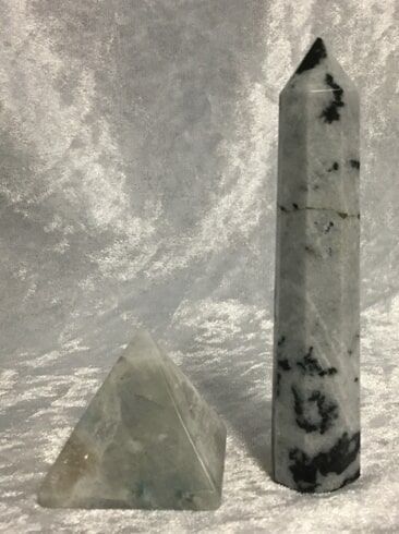 Two Distinct Types of Stone Displayed on A White Surface — Crystal Cauldron In South Mackay, QLD