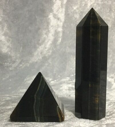 Two Pyramid-Shaped Stones in Black and Green Colors — Crystal Cauldron In South Mackay, QLD