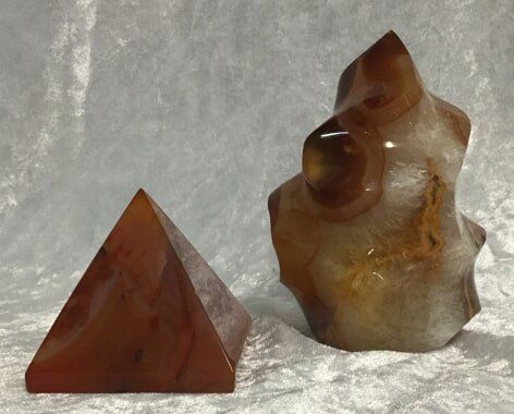 Two Pieces of Agate Alongside a Pyramid-Shaped Stone — Crystal Cauldron In South Mackay, QLD