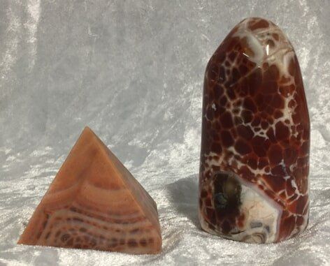 Two Distinct Types of Agate Displayed on A White Surface — Crystal Cauldron In South Mackay, QLD