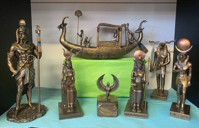 A Collection of Bronze Egyptian-Themed Figurines and A Decorative Boat — Crystal Cauldron In South Mackay, QLD