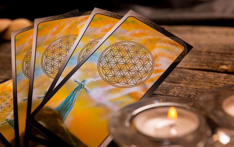 A Stack of Tarot Cards Sitting on Top of A Wooden Table — Crystal Cauldron in South Mackay, QLD