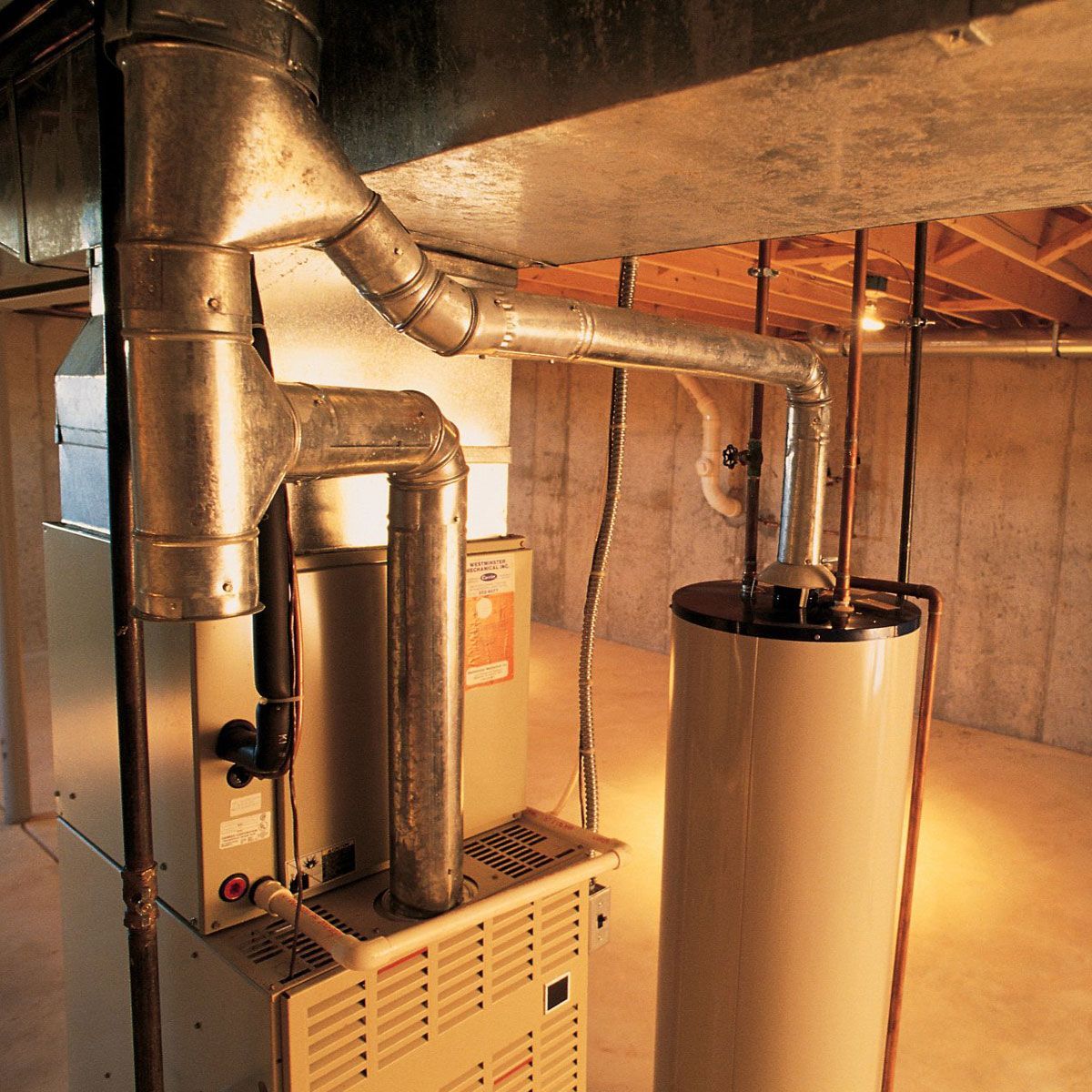 A basement with a heater and a water heater