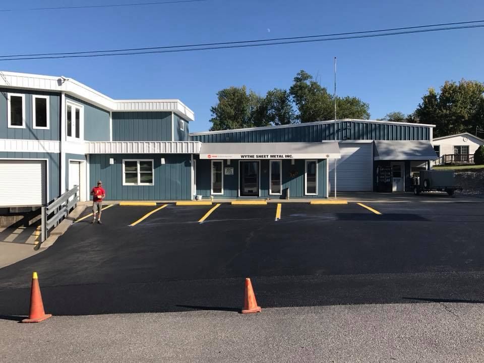 A large building with a parking lot in front of it