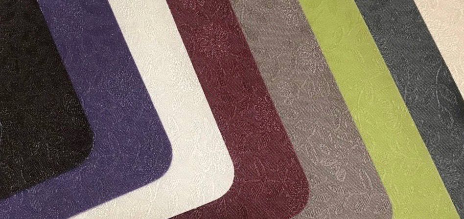 A close up of a rug with a variety of colors.