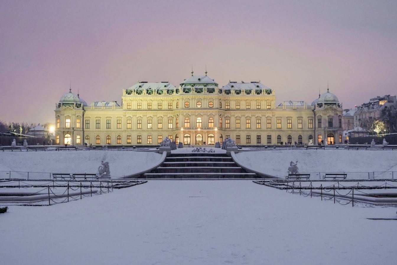 Belvedere Palace in Vienna covered in snow at dusk, showcasing the beauty of the city during January