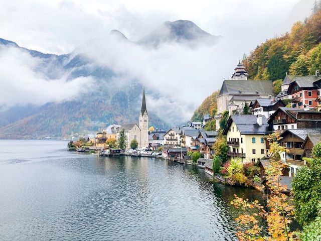 Hallstatt village reflecting on the lake with alpine mountains behind