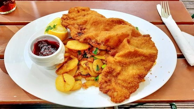 Traditional Viennese schnitzel with lemon and potato salad