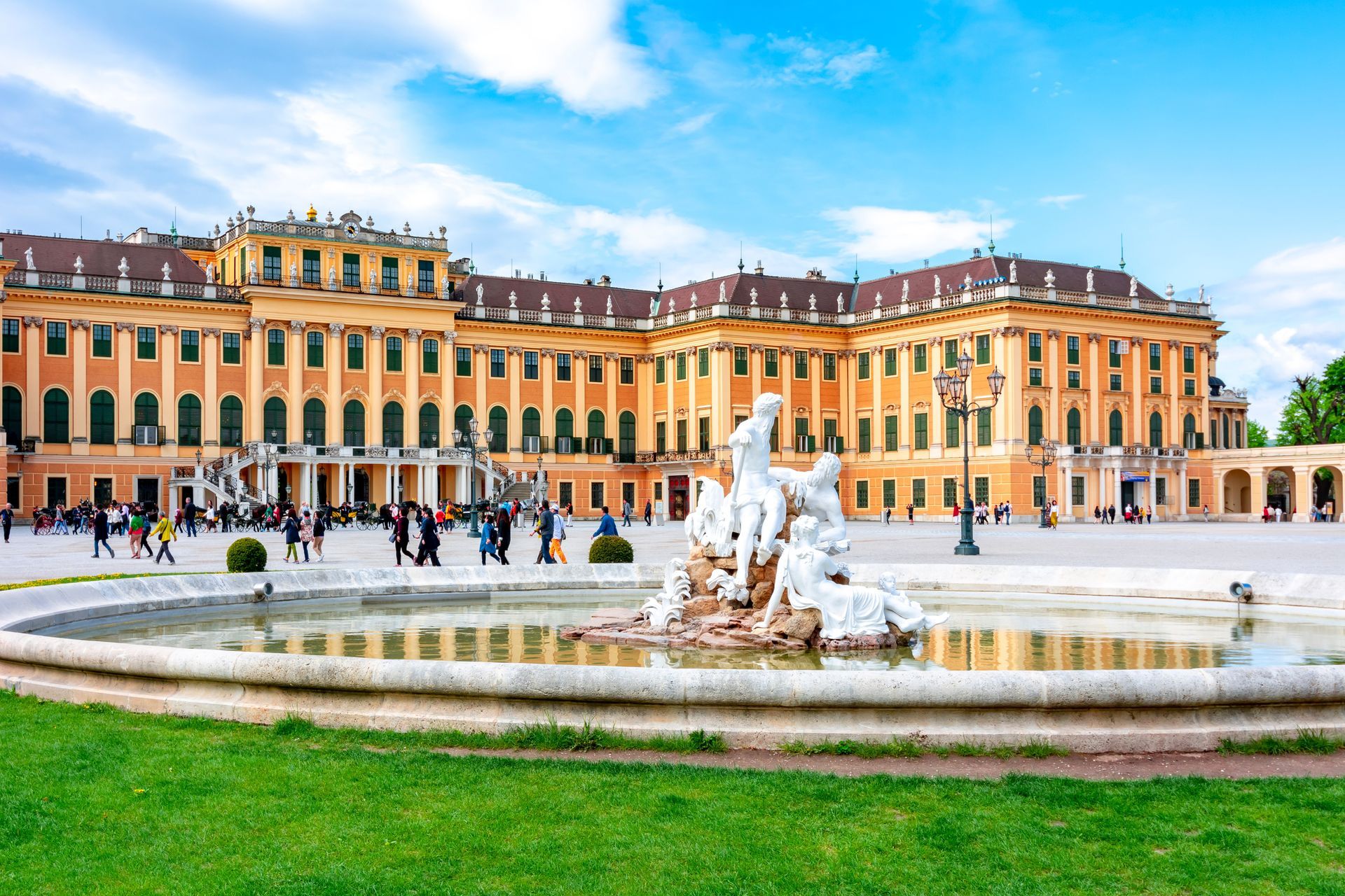 Schönbrunn Palace in Vienna with Baroque architecture and colorful gardens on a sunny day