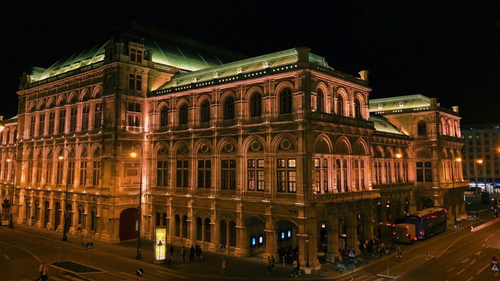 Nighttime facade of the Vienna State Opera from Albertina Vienna State Opera at night with golden lights