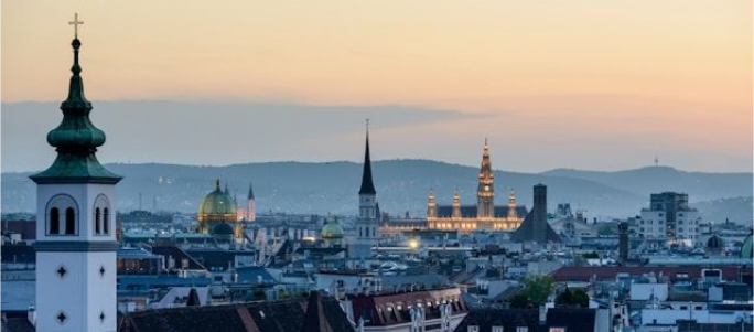 Vienna Rathaus at sunset Sunset view over Vienna with Rathaus (City Hall) and city skyline