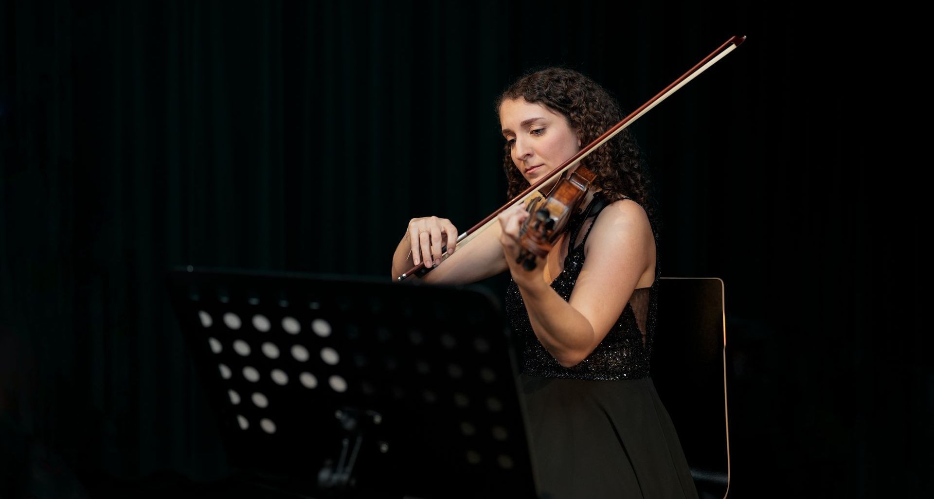 Female violinist performing at Mozart & Beethoven concert in Vienna at Haus der Musik