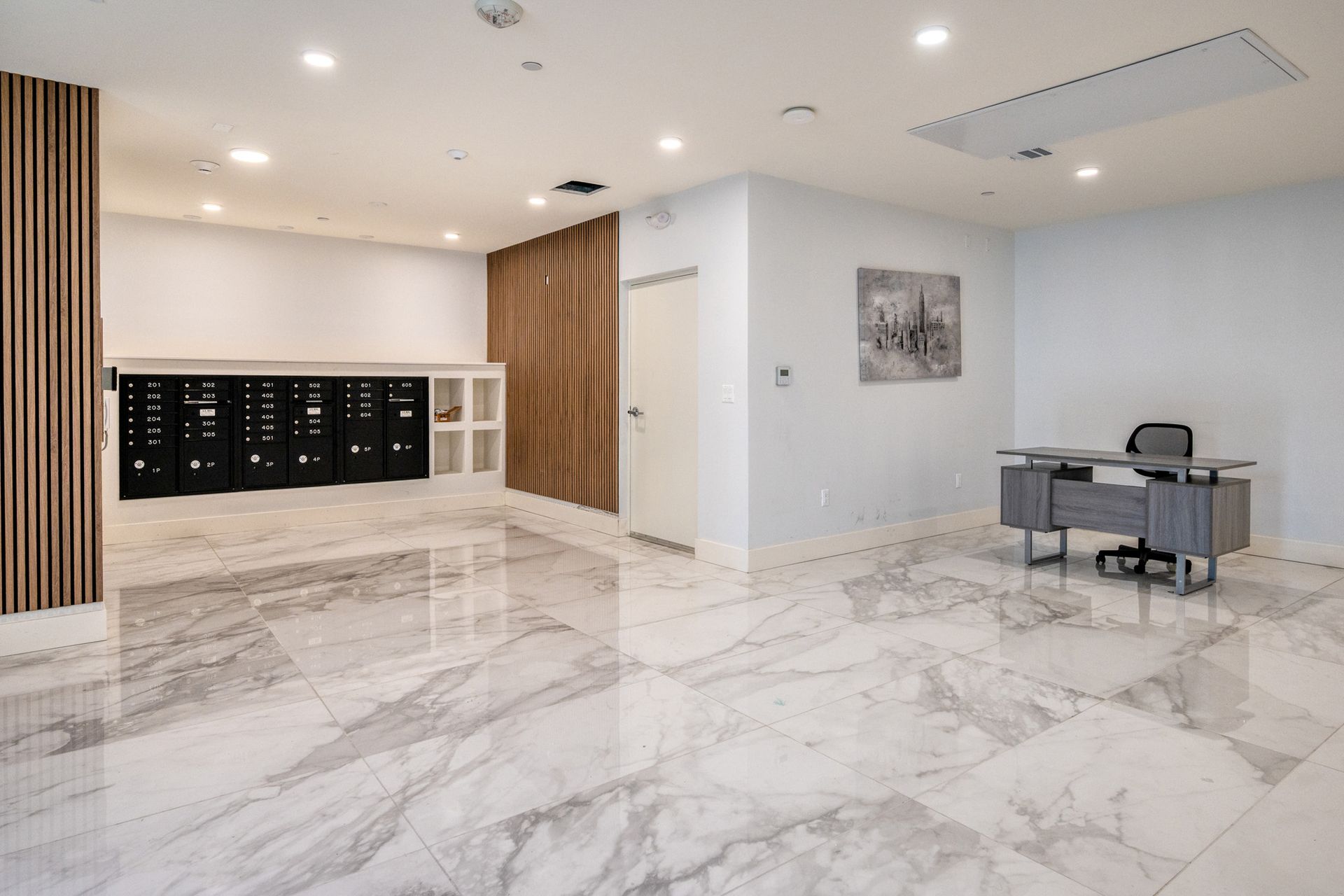 There is a desk in the middle of the room.