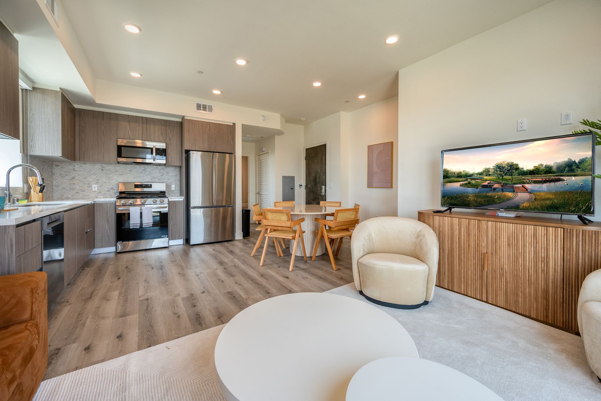 A living room filled with furniture and a flat screen tv.