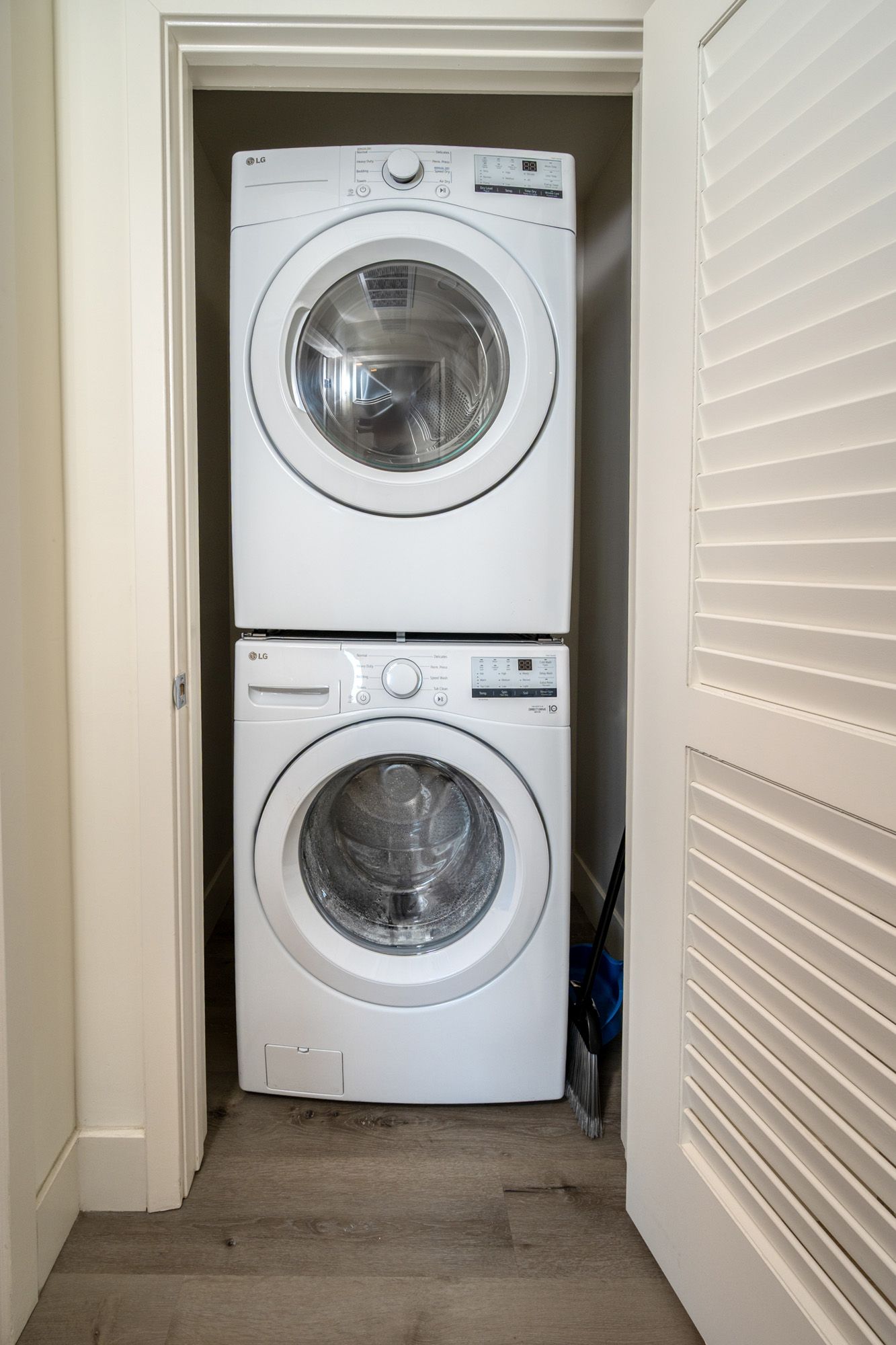 A bathroom with a toilet , sink , bathtub and mirror.