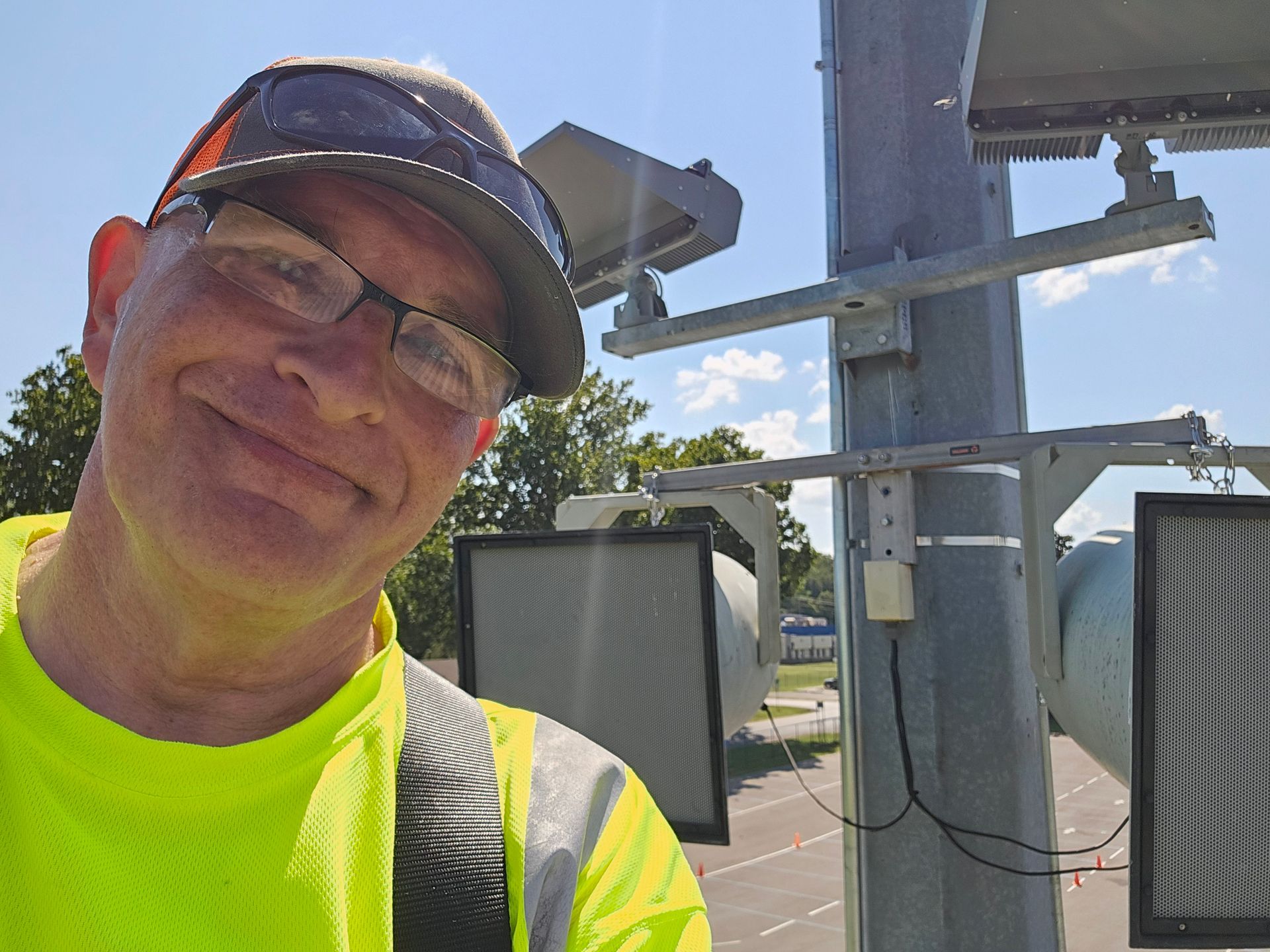 On a lift high in the air installing new speakers at Berryhill HS Football Stadium