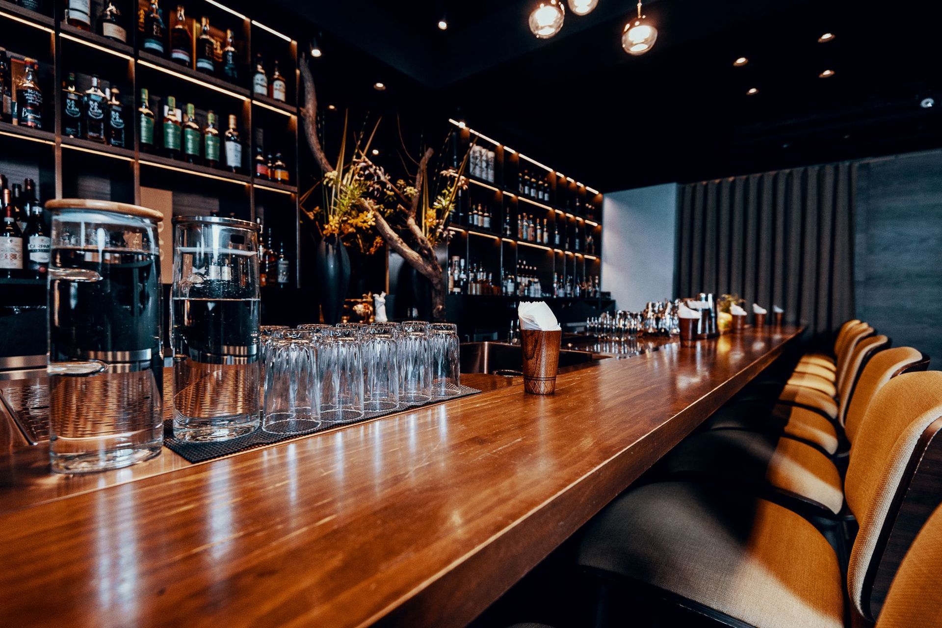 A group of people are sitting at a table drinking coffee.