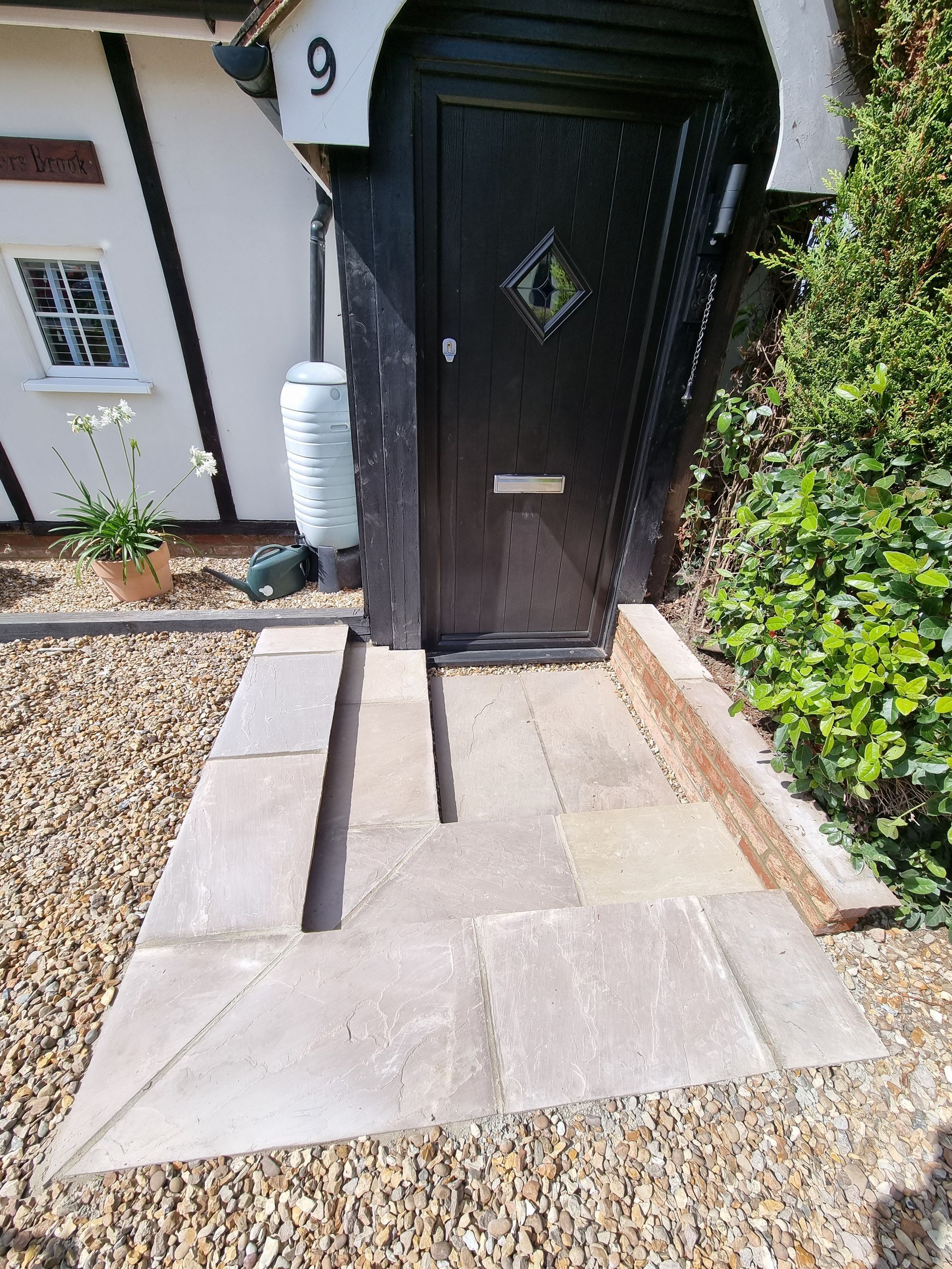 Installation of natural stone steps and retaining wall.
