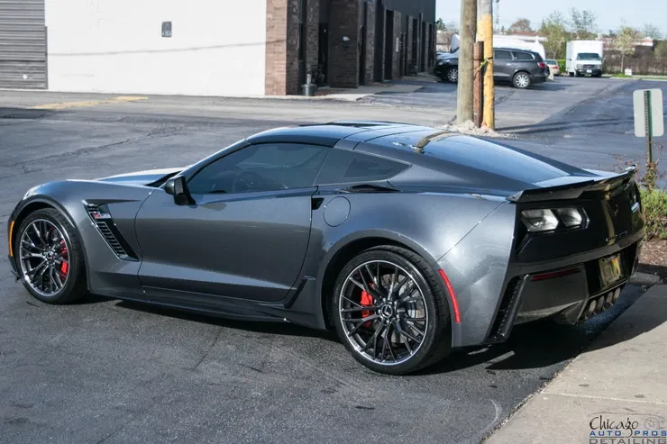 A gray corvette zr1 is parked in a parking lot.