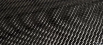 A close up of a piece of carbon fiber fabric.