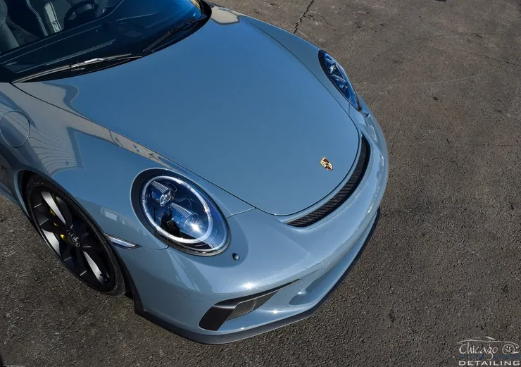 A close up of the front of a porsche 911