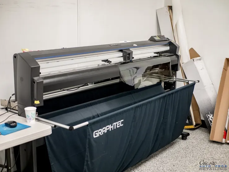 A large graphtec machine is sitting in a room