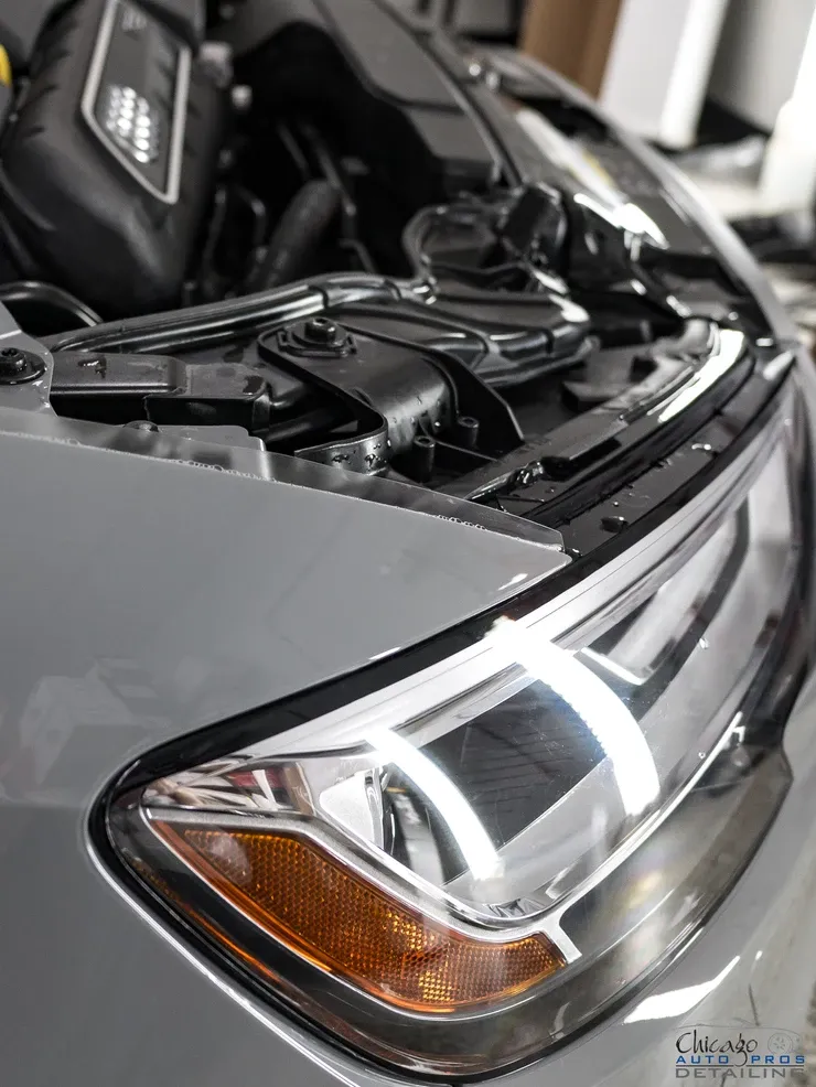 A close up of a car with the hood open.